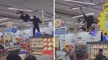 VÍDEO: Homem sobe em prateleiras e se pendura em luminária de supermercado no Rio