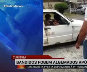 Em Curitiba, bandidos fogem algemados aps assalto